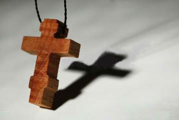Cross on a wooden necklace